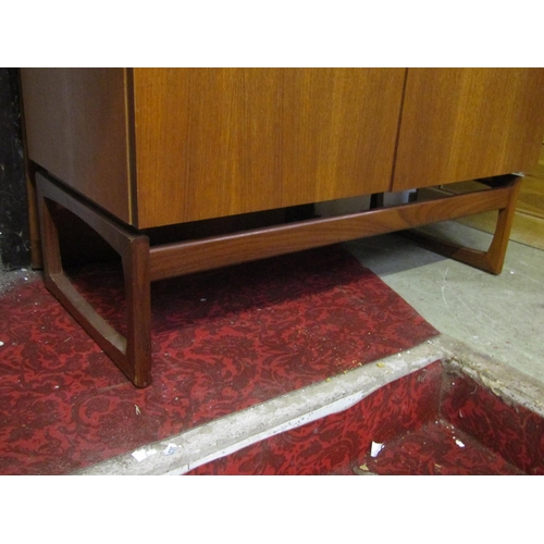 2312 - An E Gomme 'G' plan quadrill dwarf teak robe with partially fitted interior 91 cm wide x 46 cm deep ... 