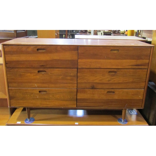 2299 - A contemporary chest of six drawer in a side by side arrangement on turned supports, 140cm wide