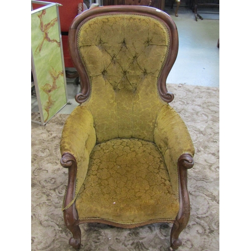 2343 - A Victorian mahogany drawing room chair with partial show wood frame, buttoned back finish on cabrio... 