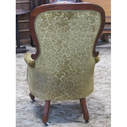 2343 - A Victorian mahogany drawing room chair with partial show wood frame, buttoned back finish on cabrio... 