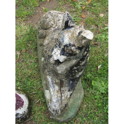 2021 - A painted and weathered cast composition stone garden ornament in the form of a recumbent dog 36 cm ... 