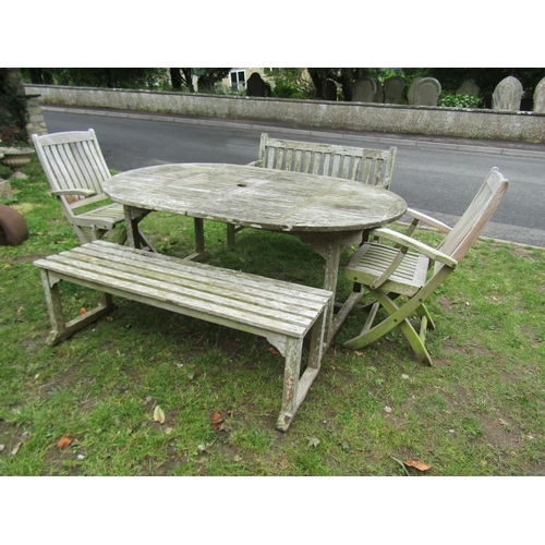 2048 - An associated suite of weathered teak garden furniture comprising a D end extending table with slatt... 