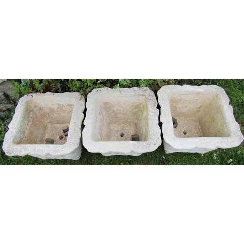 2057A - A set of three cast composition stone square tapered mock stone wall effect planters with painted fi... 