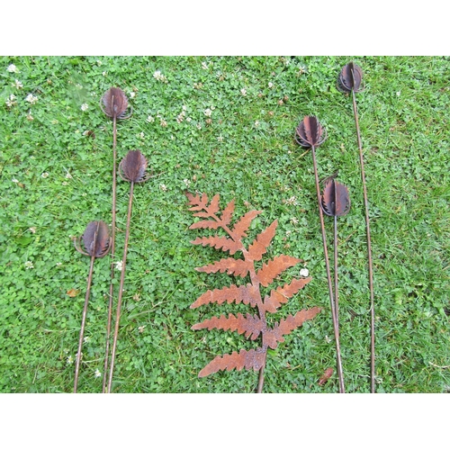 2068 - A pair of decorative ornamental heavy gauge steel garden teasel border stakes, together with a fern ... 