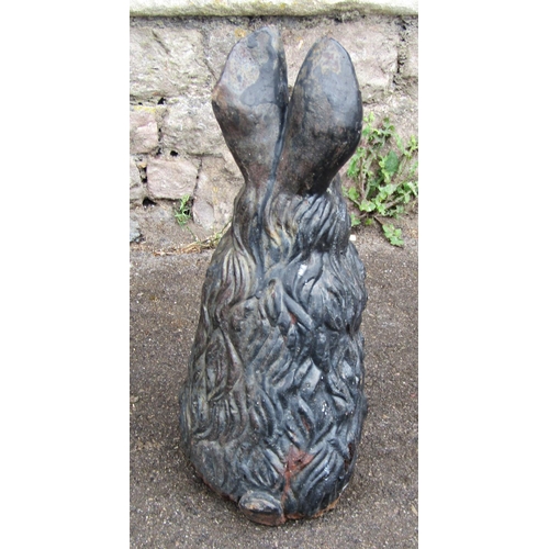 2091 - A vintage cast iron novelty garden or interior ornament in the form of a seated rabbit, 43cm high