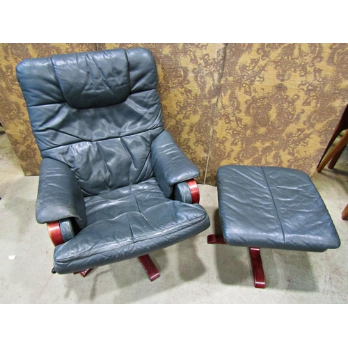 2167 - A Stressless style swivel and adjustable lounge chair and matching footstool raised on five splay pr... 