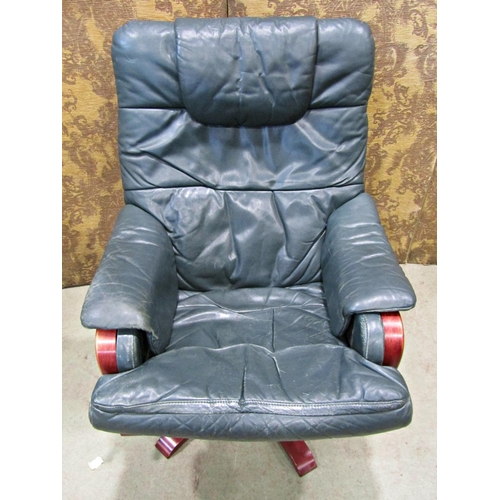 2167 - A Stressless style swivel and adjustable lounge chair and matching footstool raised on five splay pr... 