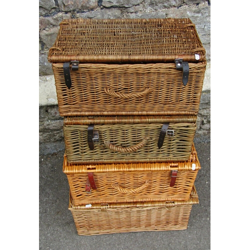 2229 - Four contemporary wicker hampers with leather straps, 52c long and smaller