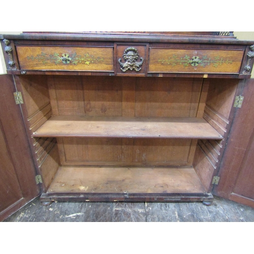 2634 - A regency rosewood chiffonier attributed to John McLean, enclosed by two panelled doors and two frie... 