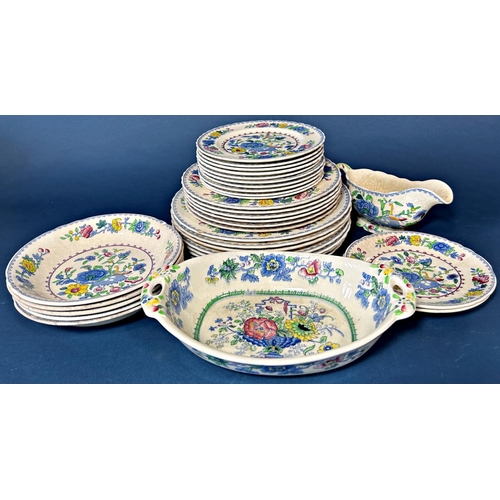 1111 - A collection of Masons Regency tableware comprising dinner plates, side plates, tea plates, two grad... 