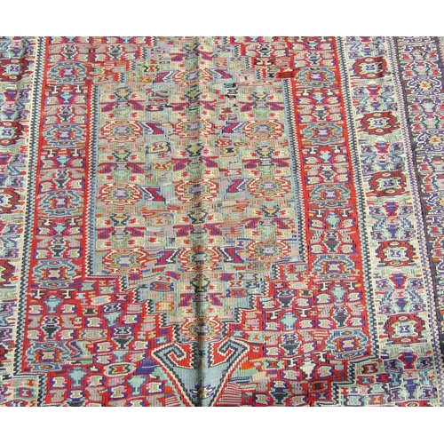 1678 - A Mercia Cotton Kilim from Sanandaj, Iran, with a tight repeating central panel and stylised floral ... 