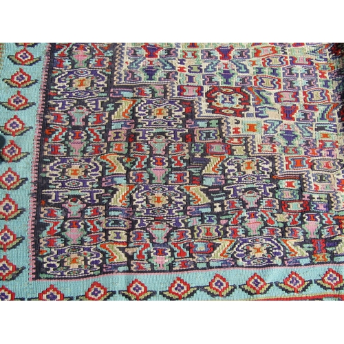 1678 - A Mercia Cotton Kilim from Sanandaj, Iran, with a tight repeating central panel and stylised floral ... 