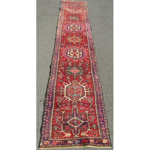 1683 - A Persian Runner, with multicoloured design, hand-knotted in pure wool, faded in areas, 330 x 64 cm