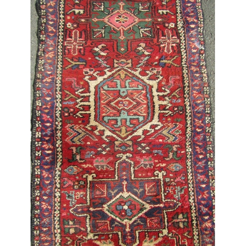 1683 - A Persian Runner, with multicoloured design, hand-knotted in pure wool, faded in areas, 330 x 64 cm