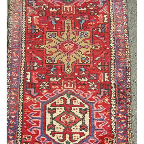 1683 - A Persian Runner, with multicoloured design, hand-knotted in pure wool, faded in areas, 330 x 64 cm