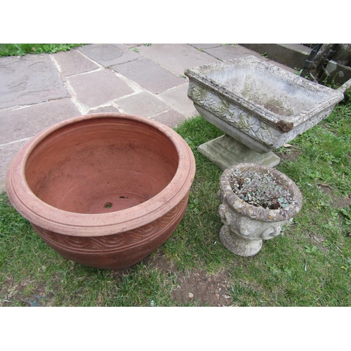 2008 - A weathered cast composition stone garden urn of square tapered form with rose relief collar raised ... 