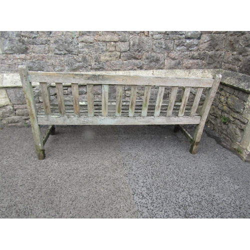 2016 - A weathered teak three seat garden bench with slatted seat and back, probably a Lister example, labe... 