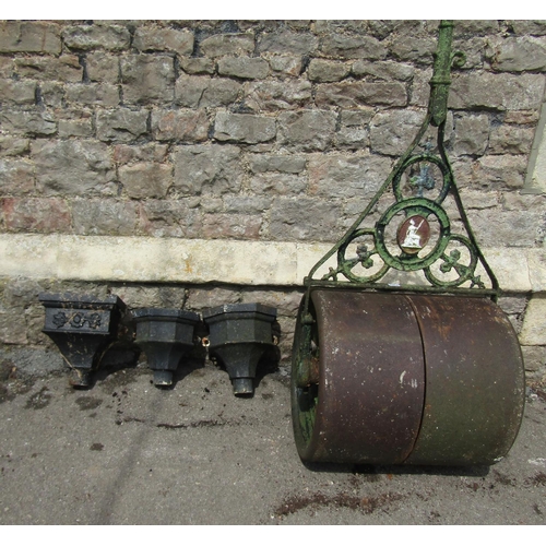 2057 - An antique cast iron garden roller, with oval seated Britannia plaque, 58cm (full width) together wi... 