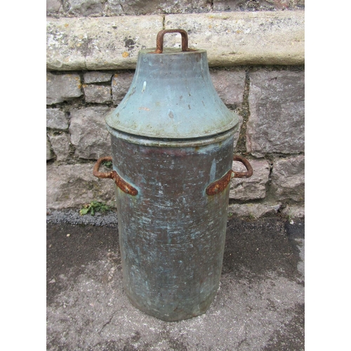 2078 - An old weathered copper or possibly brass cylindrical vessel with domed lid and fixed iron handles, ... 