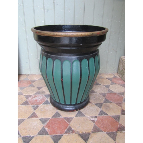 2084 - A heavy painted cast iron oviform planter with repeating fluted body, 52cm diameter at rim, x 60cm h... 