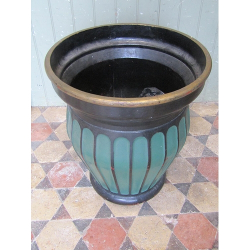 2084 - A heavy painted cast iron oviform planter with repeating fluted body, 52cm diameter at rim, x 60cm h... 