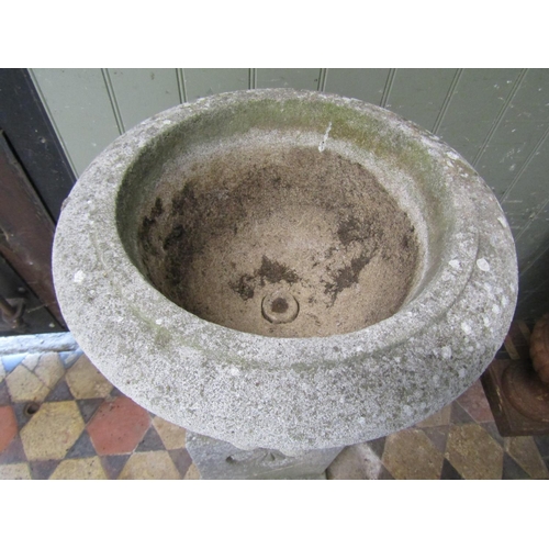 2095 - A nicely weathered cast composition stone garden urn, the circular lobed bowl with flared rim, raise... 