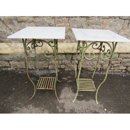 2098 - A pair of light green painted iron work conservatory or garden table with simple scrollwork detail b... 