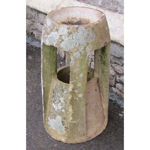 2108 - A weathered Fawcett Down Draught Preventing chimney Pot, of tapered and moulded cylindrical form wit... 