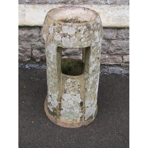 2108 - A weathered Fawcett Down Draught Preventing chimney Pot, of tapered and moulded cylindrical form wit... 