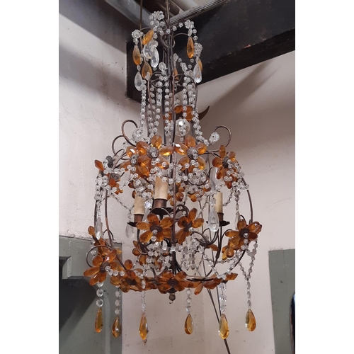 2114 - An open scrolling light metal hanging ceiling light with floral detail, trailing prism swags and tin... 