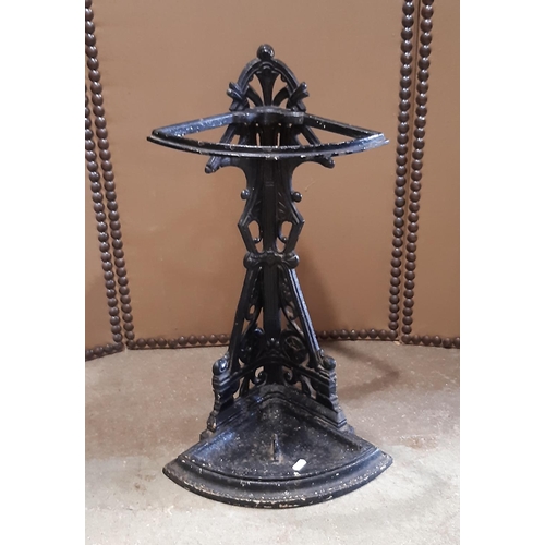 2122 - A late Victorian cast iron corner umbrella stand with decorative pierced and scrolling foliate detai... 