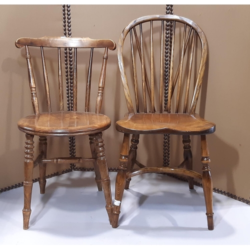 2141 - A good quality Windsor hoop and stick back dining  chair with saddle shaped seat raised on turned su... 