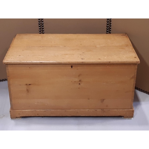 2145 - A 19th century stripped and waxed pine blanket box with hinged lid, exposed dovetail construction an... 