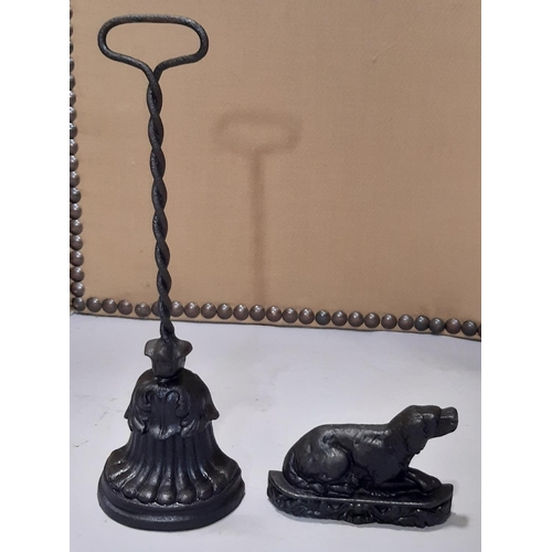 2149 - A cast iron door porter with loop handle stamped to back AK & Sons, 489, 39 cm high together with a ... 