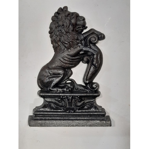 2150 - A matched pair of classical rampant lion cast iron door porters, 38 & 35 cm high