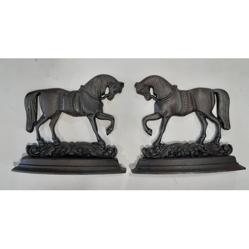 2152 - A pair of cast iron novelty prancing horse door porters 25 cm high