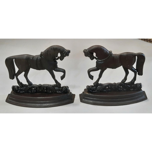 2152 - A pair of cast iron novelty prancing horse door porters 25 cm high