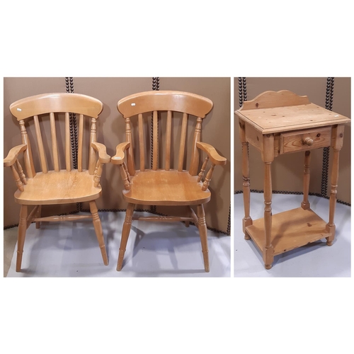 A pair of modern stained beechwood Windsor lathe back kitchen elbow chairs together with a small stripped pine side table with frieze drawer 46 cm wide (3)