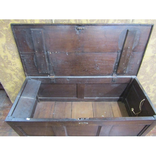 2595A - An 18th century oak panelled coffer with plank top