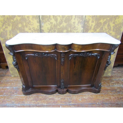 2596 - A Victorian rosewood chiffonier enclosed by two panelled doors with canted corners with applied moul... 