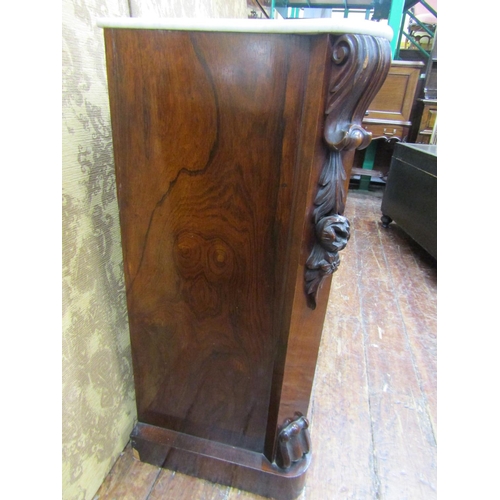 2596 - A Victorian rosewood chiffonier enclosed by two panelled doors with canted corners with applied moul... 