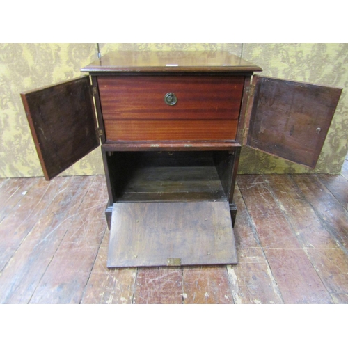 2599 - A Georgian mahogany side cupboard, the lower section enclosed by a full front disguised as two drawe... 