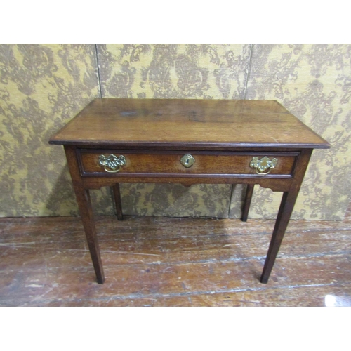 2603 - A Georgian mahogany side table with frieze drawer raised on square taper legs, the top crossbanded i... 