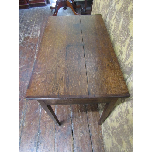 2603 - A Georgian mahogany side table with frieze drawer raised on square taper legs, the top crossbanded i... 