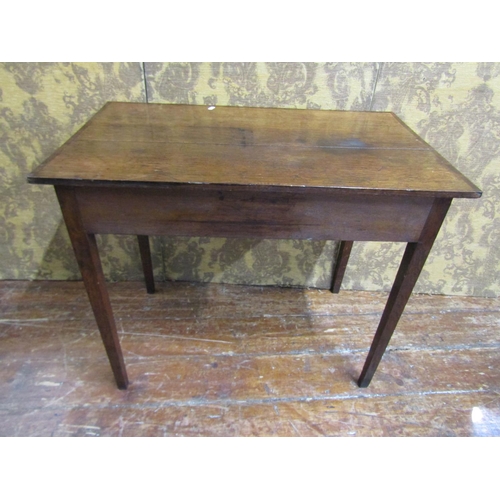 2603 - A Georgian mahogany side table with frieze drawer raised on square taper legs, the top crossbanded i... 