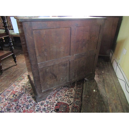 2610 - A Georgian mahogany secretaire chest, the secretaire with fitted drawers and central alcoves, the kn... 