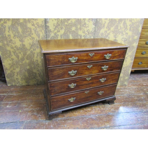 2620 - A Georgian mahogany chest of four long graduated drawers on ogee supports, 93 cm wide