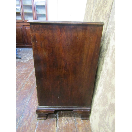 2620 - A Georgian mahogany chest of four long graduated drawers on ogee supports, 93 cm wide