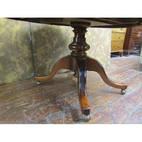 2622 - A Victorian walnut and figured walnut loo table with quarter veneered top, shaped outline and raised... 