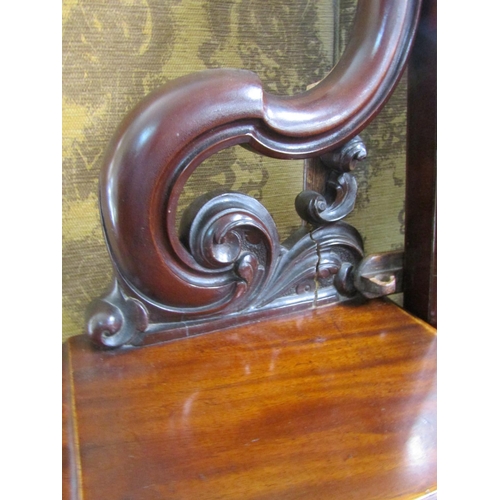 2624 - A Victorian mahogany Duchess dressing table with arched mirror, carved and shaped supports open an o... 